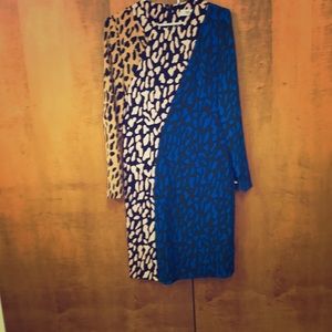 Fitted sheath Dress with long sleeves.